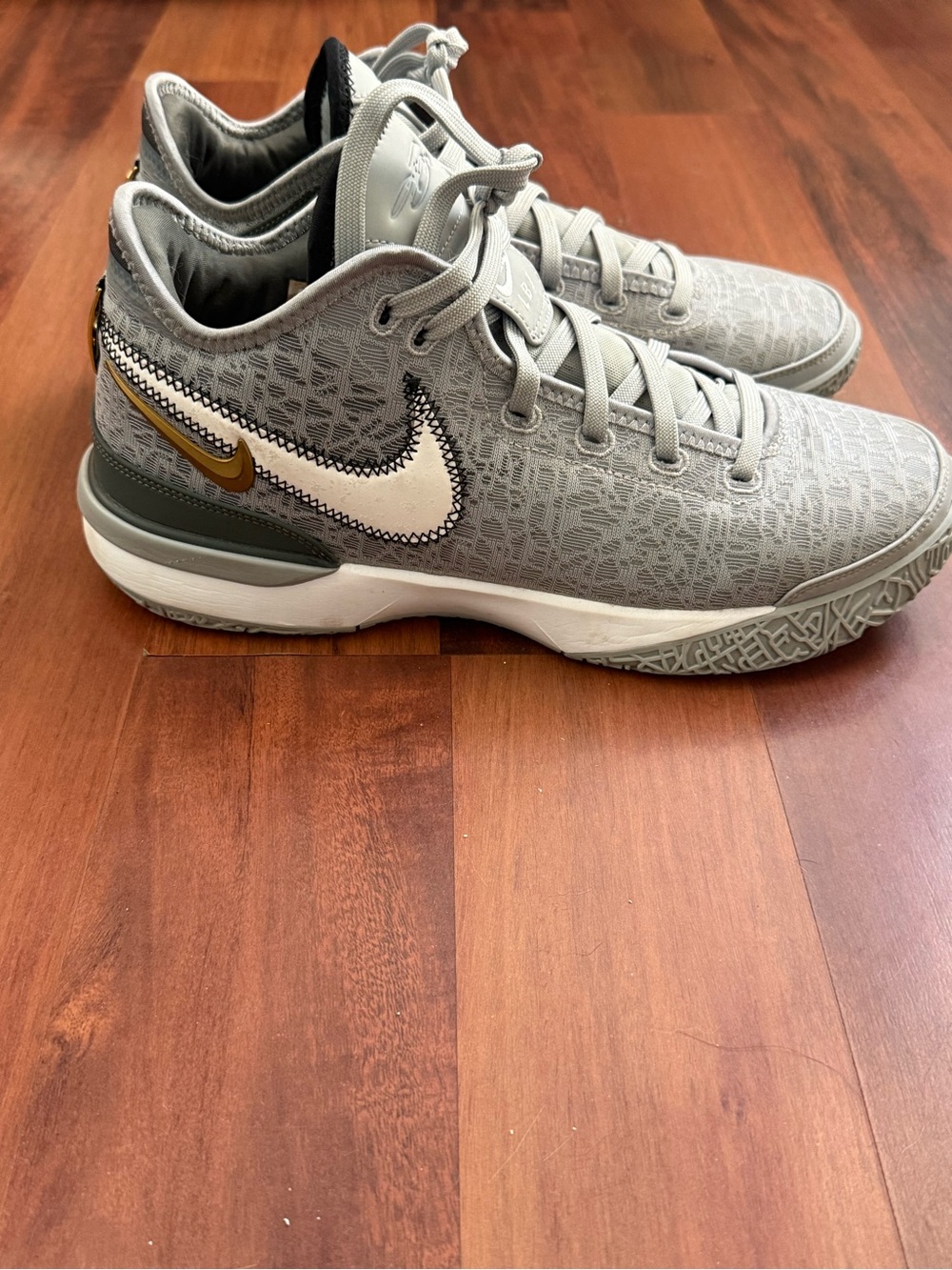 Nike Men’s Grey and White Basketball Sneakers with Gold Accent